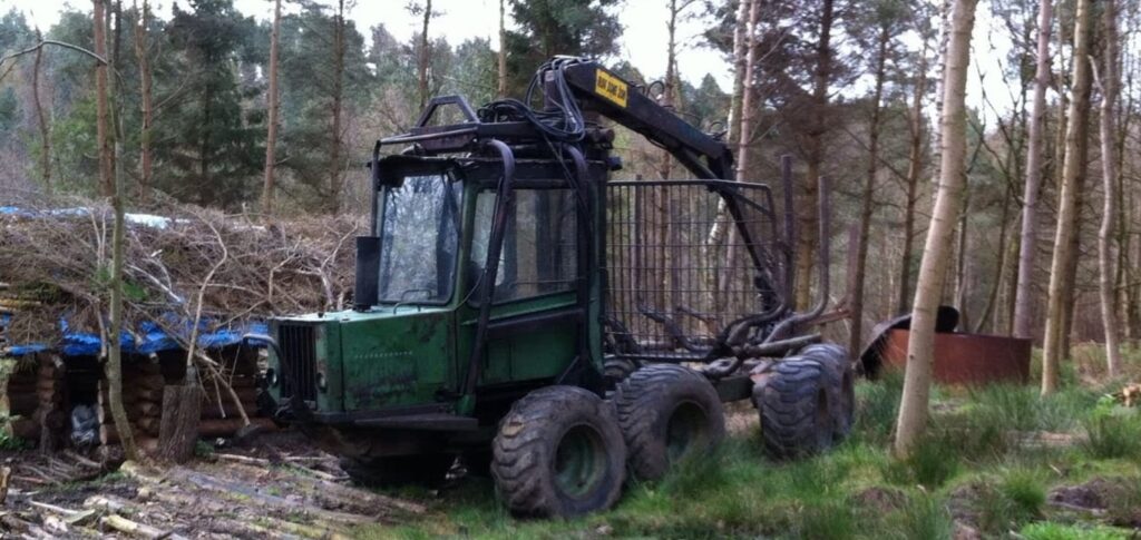 tree forwarder at work in forrest